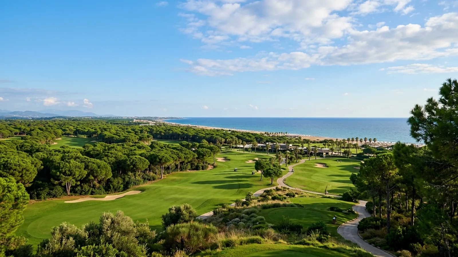 Kadriye, Türkiye — the countryside around Kadriye near Belek, green golf fairways and pine woods between the resort area and the sandy coastline.