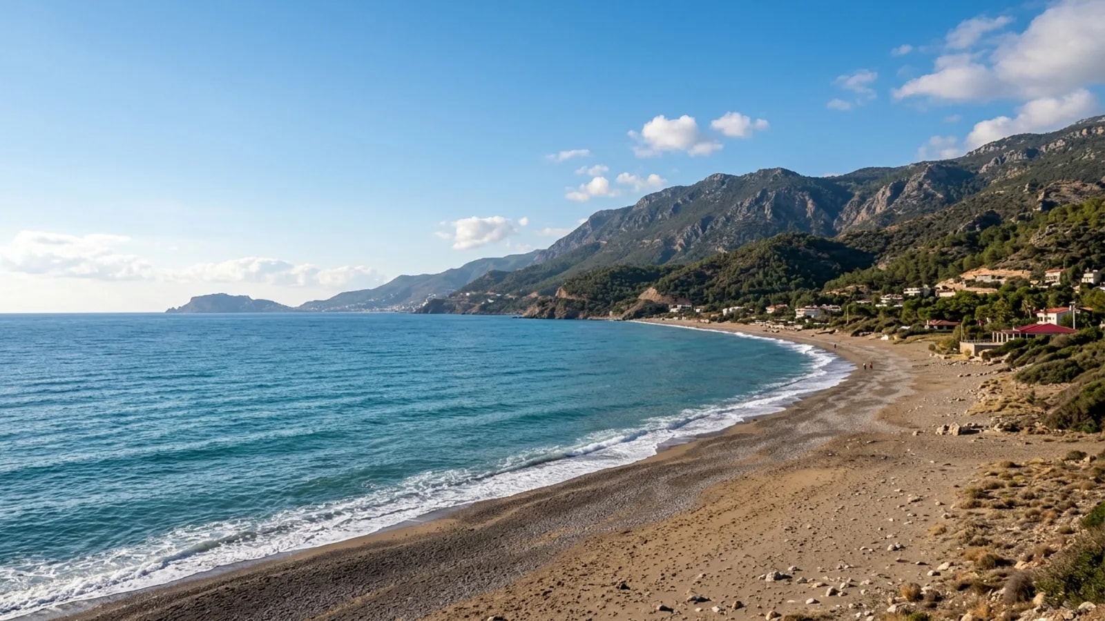 Payallar, Türkiye — the coastline at Payallar west of Alanya, a sand and shingle beach with the Taurus foothills close behind.